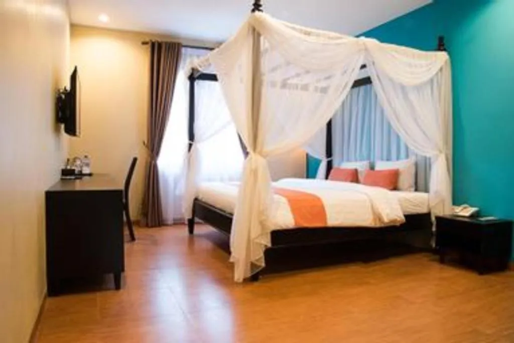 Bed in Ole Suite Hotel