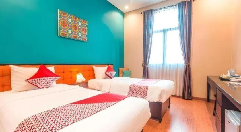 Bed in Ole Suite Hotel