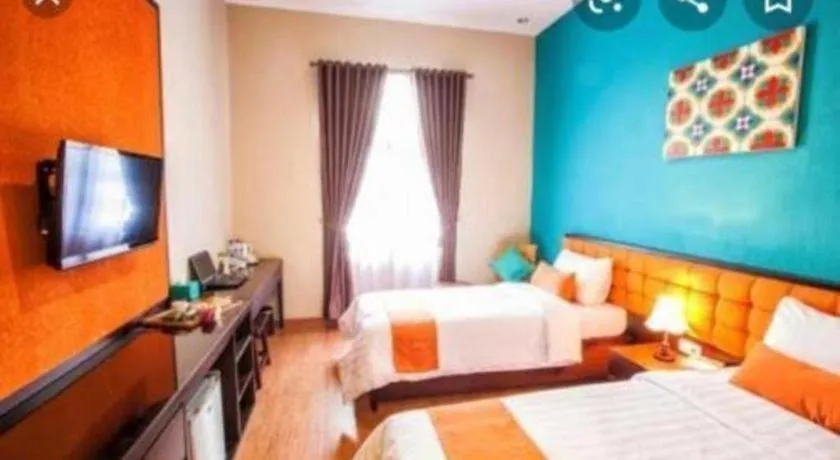 Bed in Ole Suite Hotel