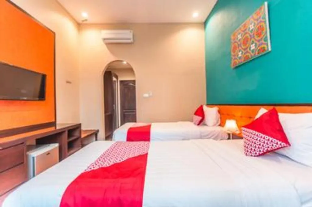 Bed in Ole Suite Hotel