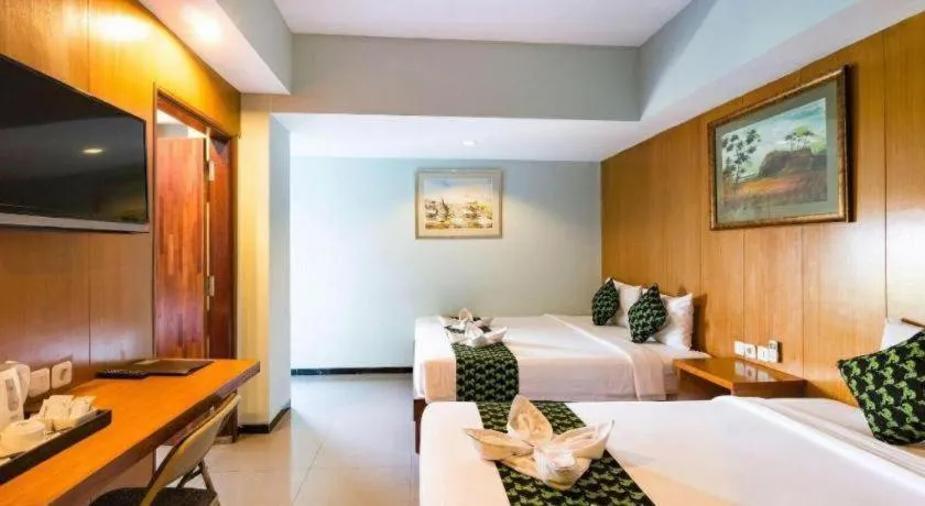 Bed in Hadi Poetra Hotel