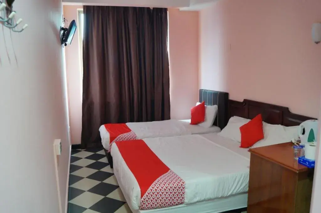 Bed in BudgetOne Hotel Bed in BudgetOne Hotel