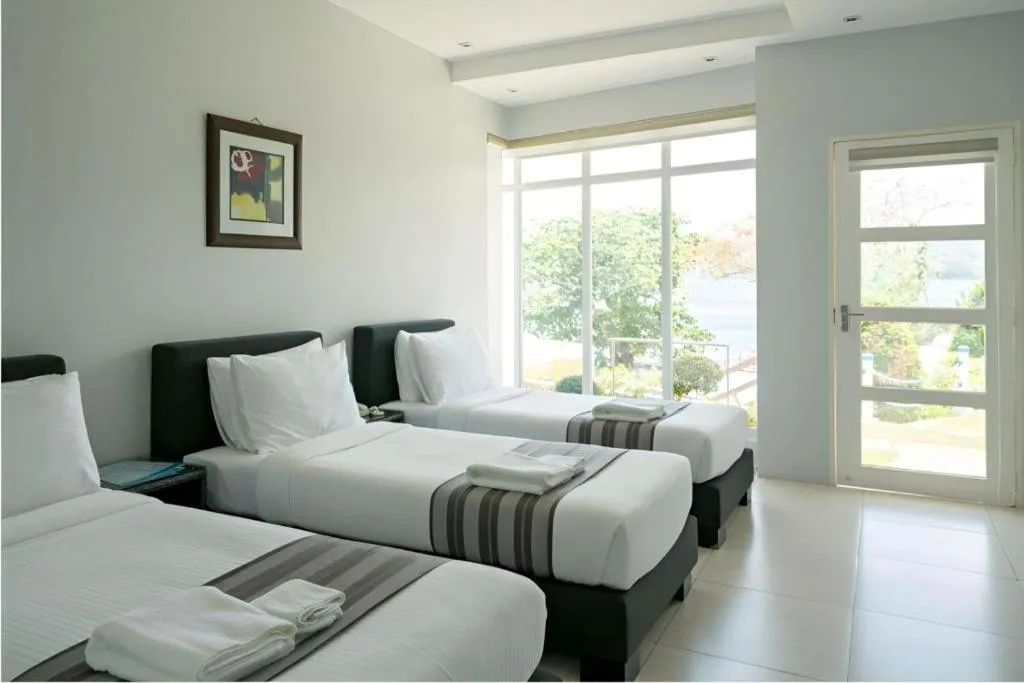 Bed in Anilao Awari Bay Resort
