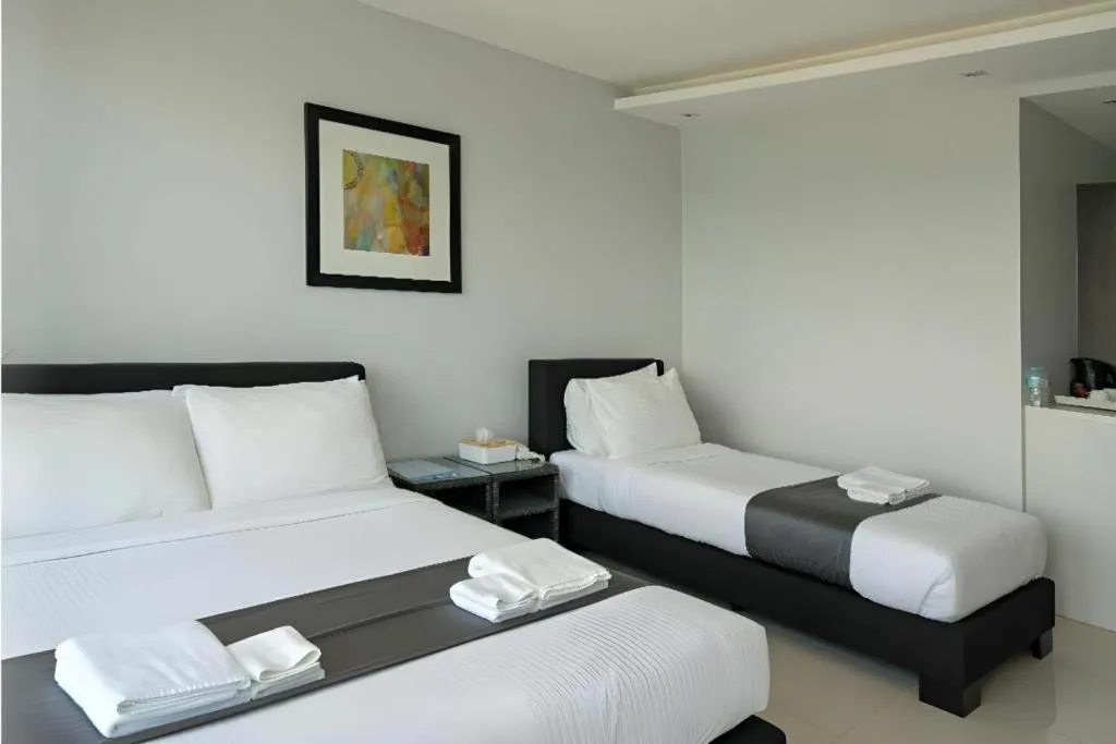 Bed in Anilao Awari Bay Resort