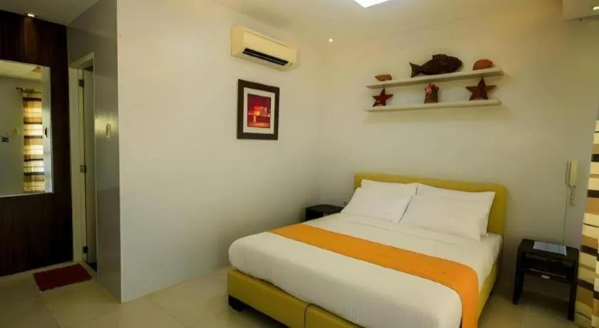 Bed in Anilao Awari Bay Resort