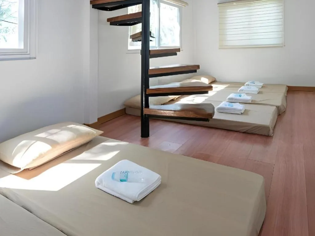 Bed in Anilao Awari Bay Resort