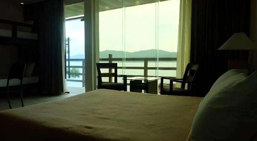 Bed in Anilao Awari Bay Resort