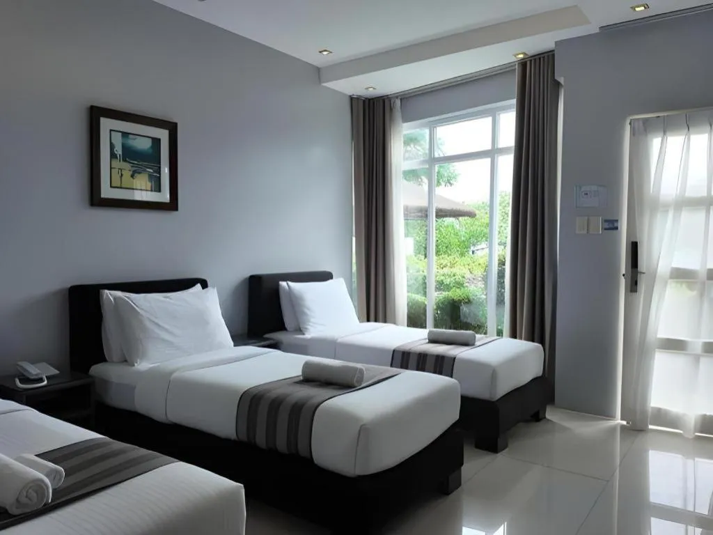 Bed in Anilao Awari Bay Resort