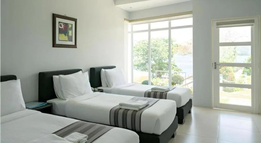 Bed in Anilao Awari Bay Resort