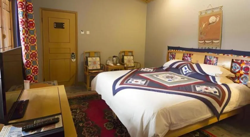 Bed in The Silk Road Dunhuang Hotel