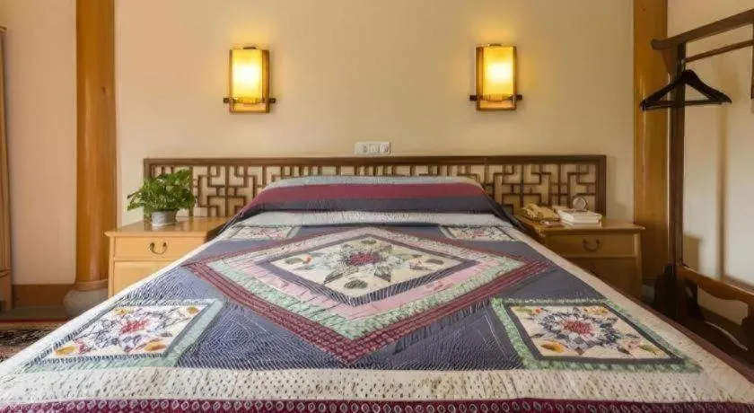 Bed in The Silk Road Dunhuang Hotel