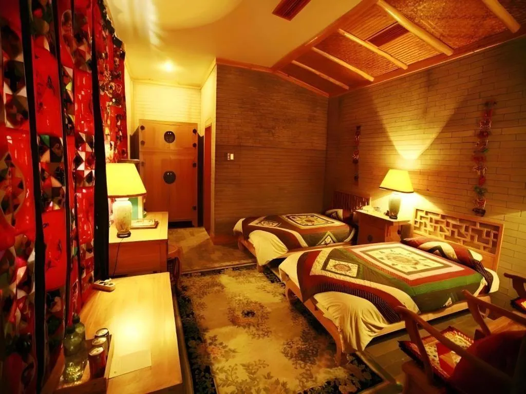 Bed in The Silk Road Dunhuang Hotel
