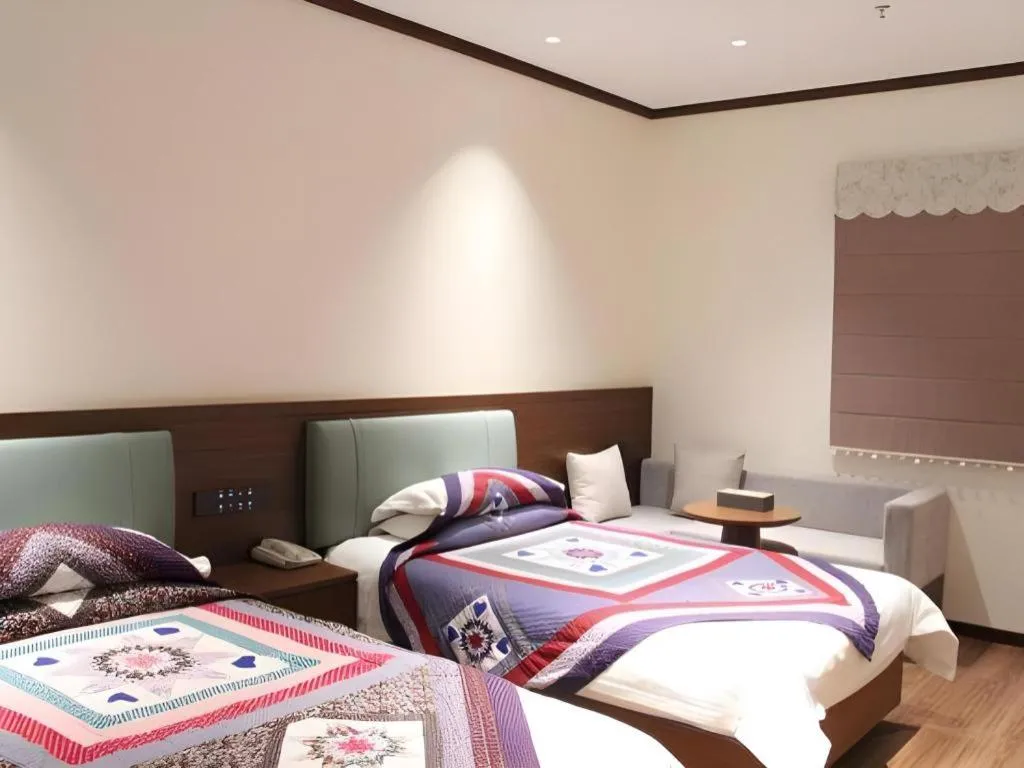 Bed in The Silk Road Dunhuang Hotel