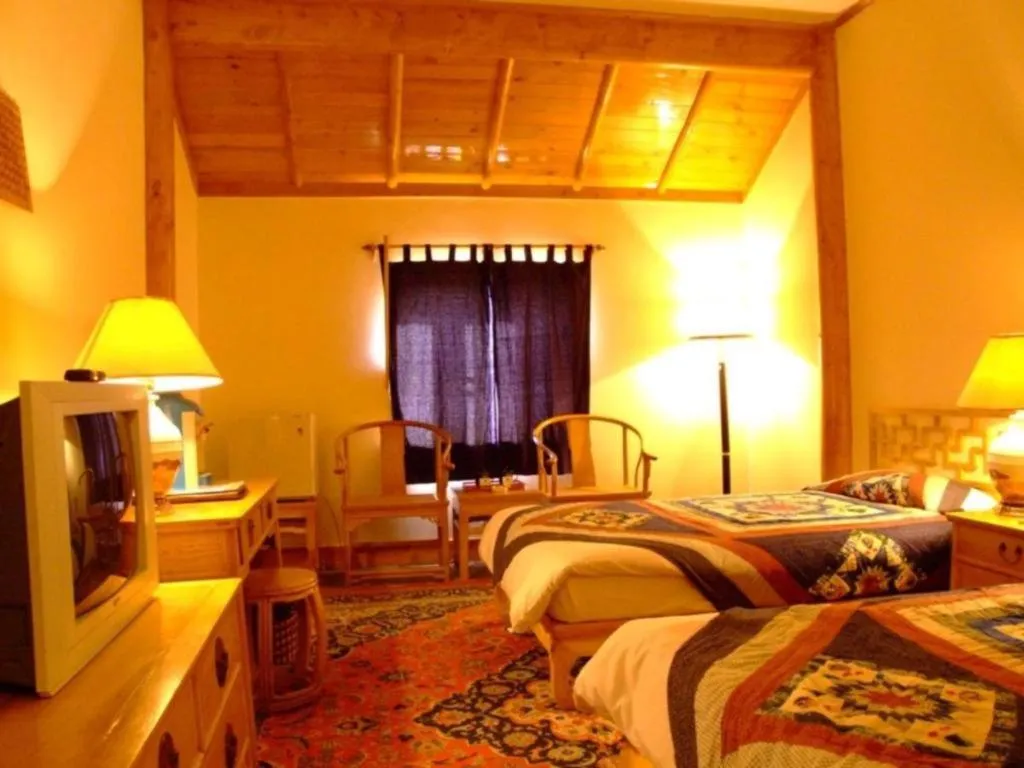 Bed in The Silk Road Dunhuang Hotel