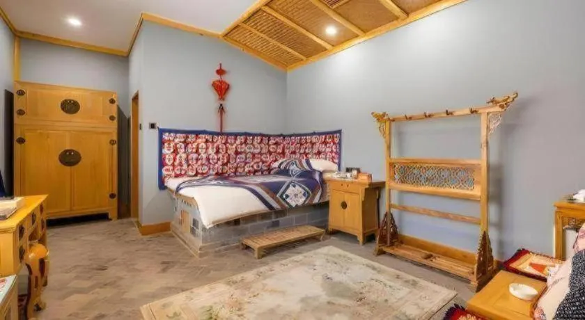 Bed in The Silk Road Dunhuang Hotel