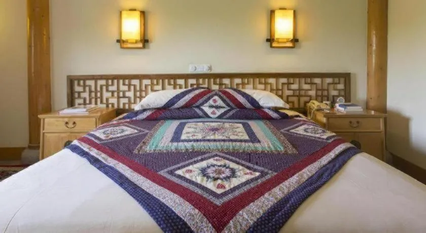 Bed in The Silk Road Dunhuang Hotel
