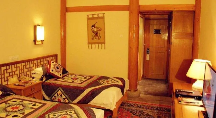 Bed in The Silk Road Dunhuang Hotel