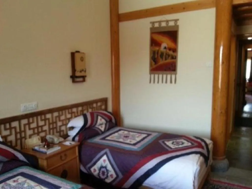 Bed in The Silk Road Dunhuang Hotel