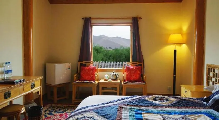 Bed in The Silk Road Dunhuang Hotel