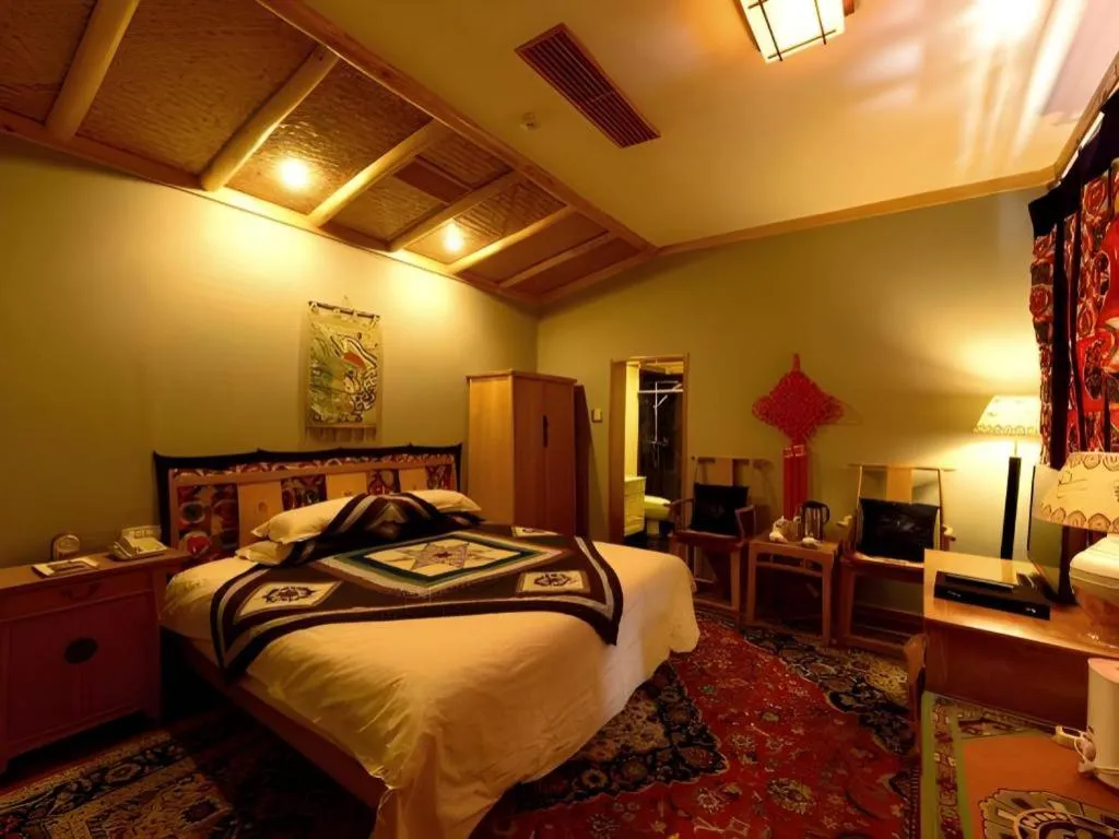 Bed in The Silk Road Dunhuang Hotel