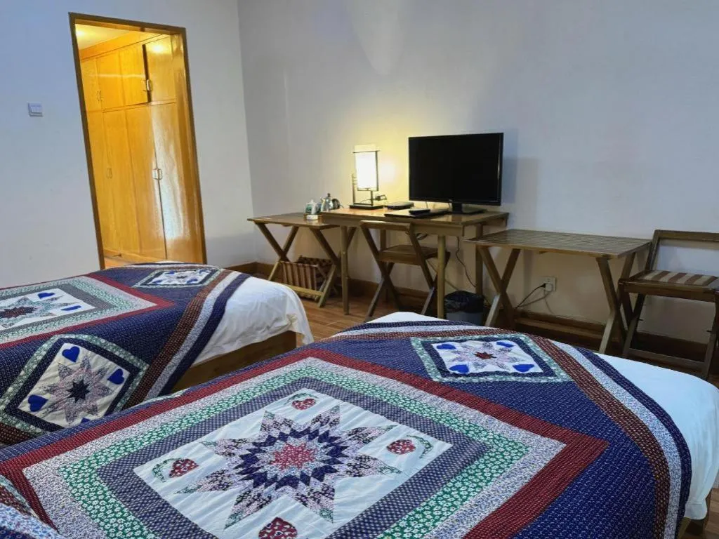 Bed in The Silk Road Dunhuang Hotel