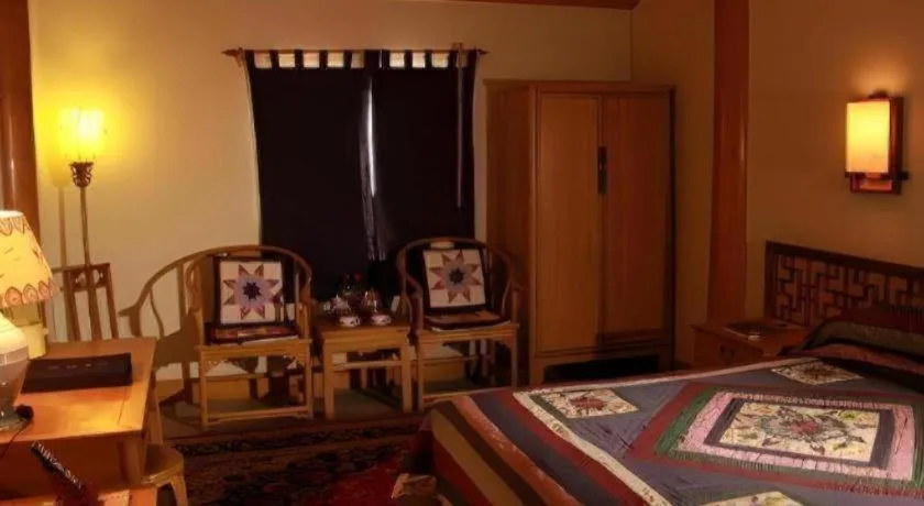 Bed in The Silk Road Dunhuang Hotel