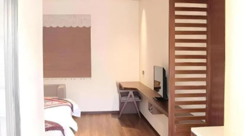 Bed in The Silk Road Dunhuang Hotel