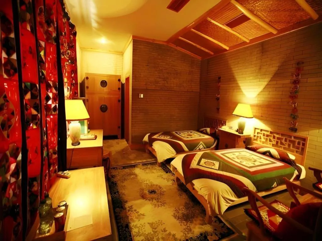 Bed in The Silk Road Dunhuang Hotel