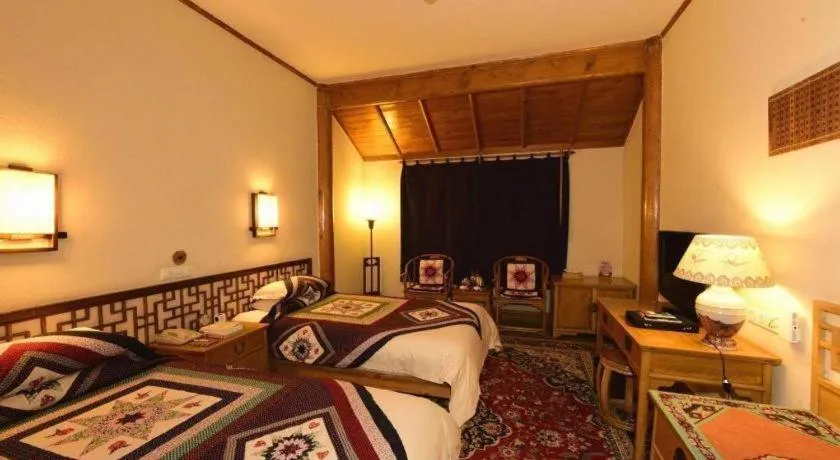 Bed in The Silk Road Dunhuang Hotel