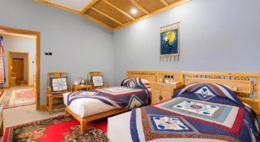 Bed in The Silk Road Dunhuang Hotel