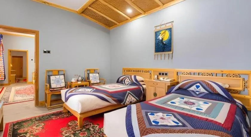 Bed in The Silk Road Dunhuang Hotel