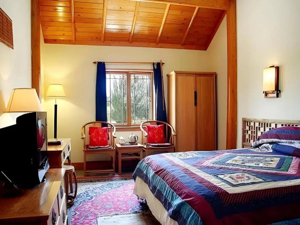 Bed in The Silk Road Dunhuang Hotel