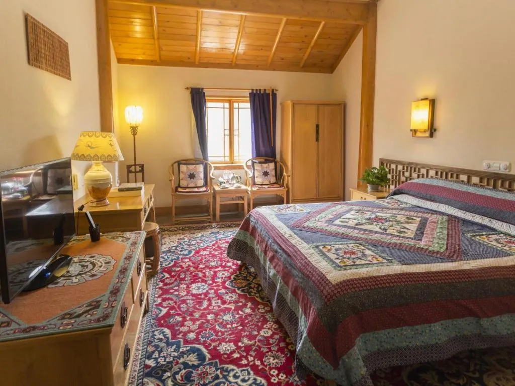 Bed in The Silk Road Dunhuang Hotel