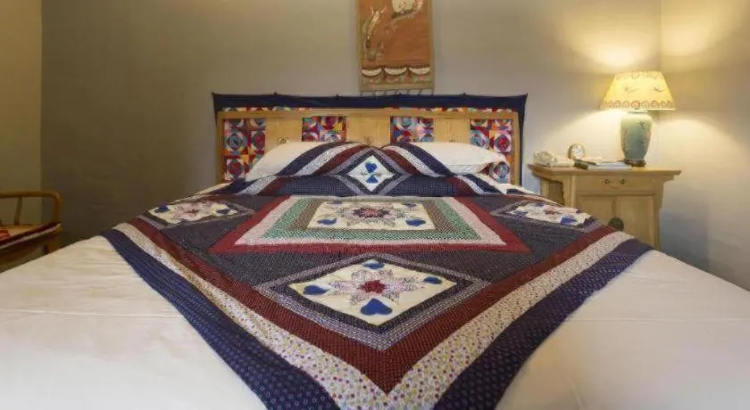 Bed in The Silk Road Dunhuang Hotel