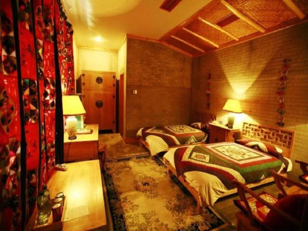 Bed in The Silk Road Dunhuang Hotel