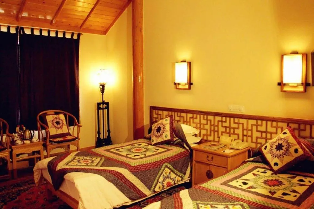 Bed in The Silk Road Dunhuang Hotel