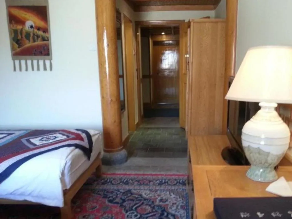 Bed in The Silk Road Dunhuang Hotel