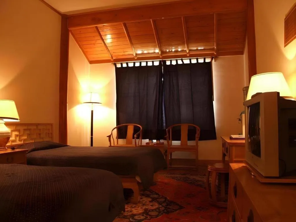 Bed in The Silk Road Dunhuang Hotel