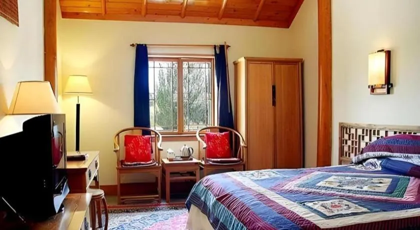 Bed in The Silk Road Dunhuang Hotel