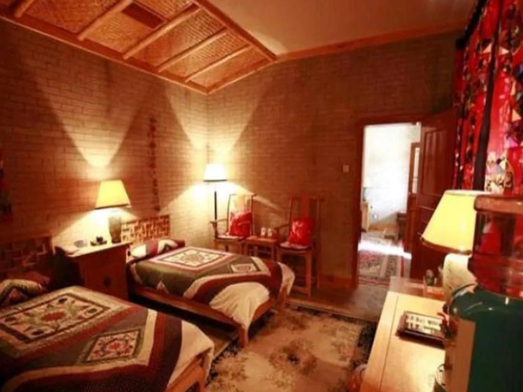Bed in The Silk Road Dunhuang Hotel
