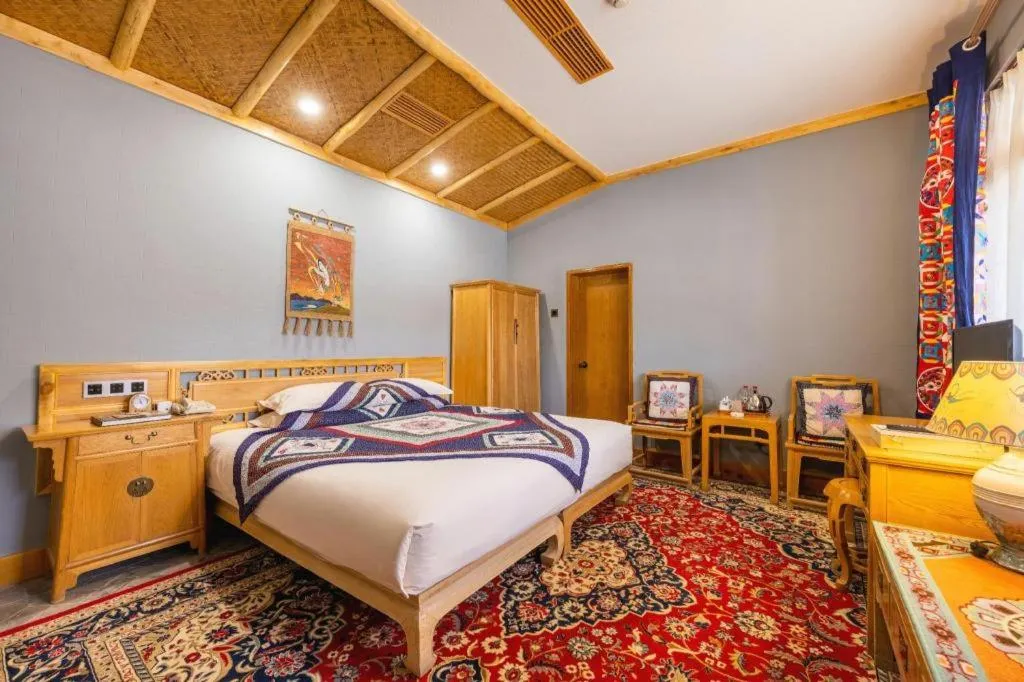 Bed in The Silk Road Dunhuang Hotel