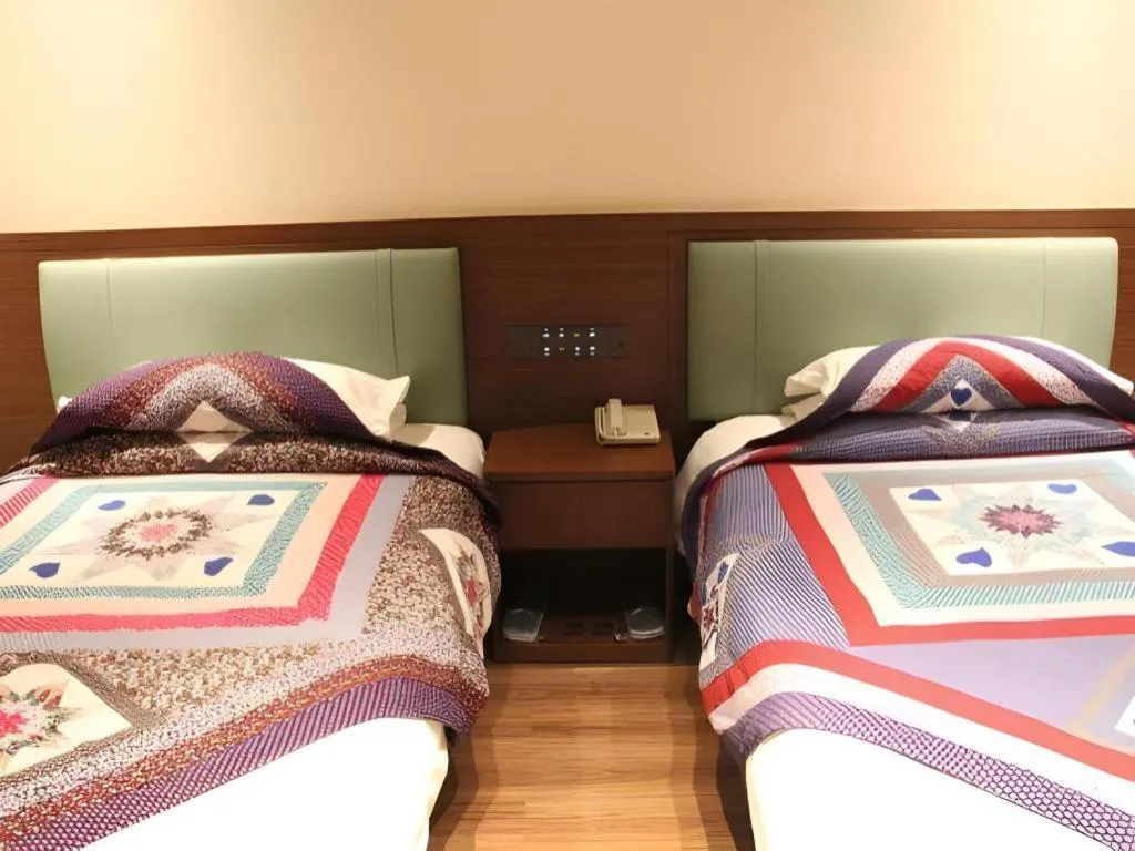 Bed in The Silk Road Dunhuang Hotel