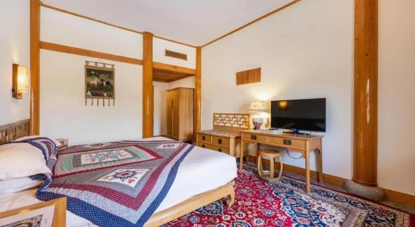 Bed in The Silk Road Dunhuang Hotel