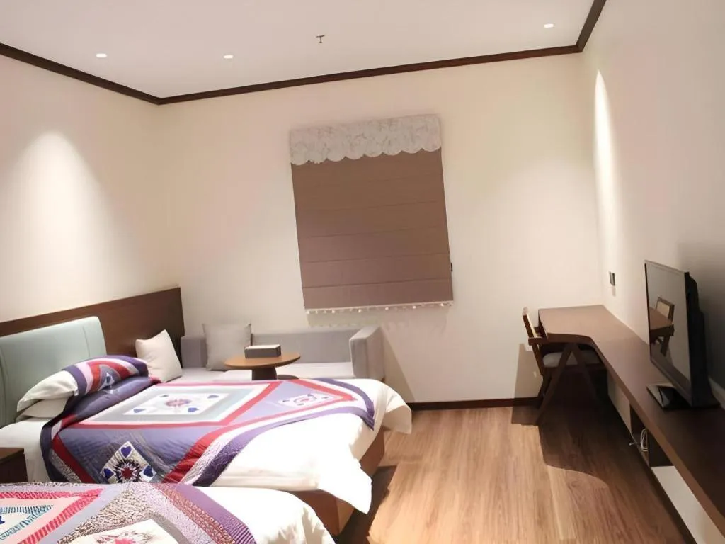 Bed in The Silk Road Dunhuang Hotel