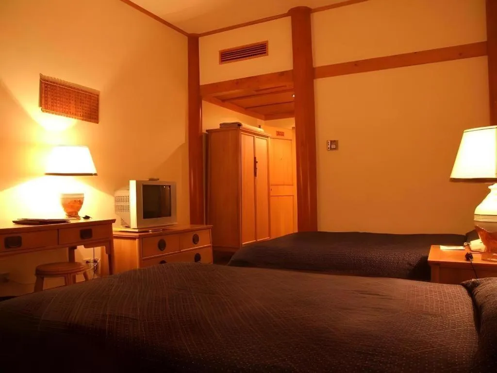 Bed in The Silk Road Dunhuang Hotel