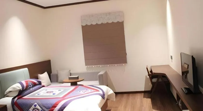 Bed in The Silk Road Dunhuang Hotel