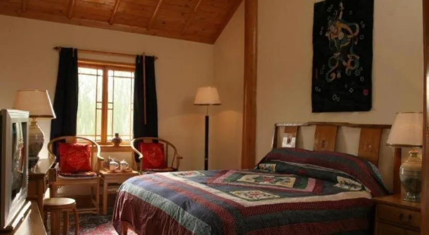 Bed in The Silk Road Dunhuang Hotel