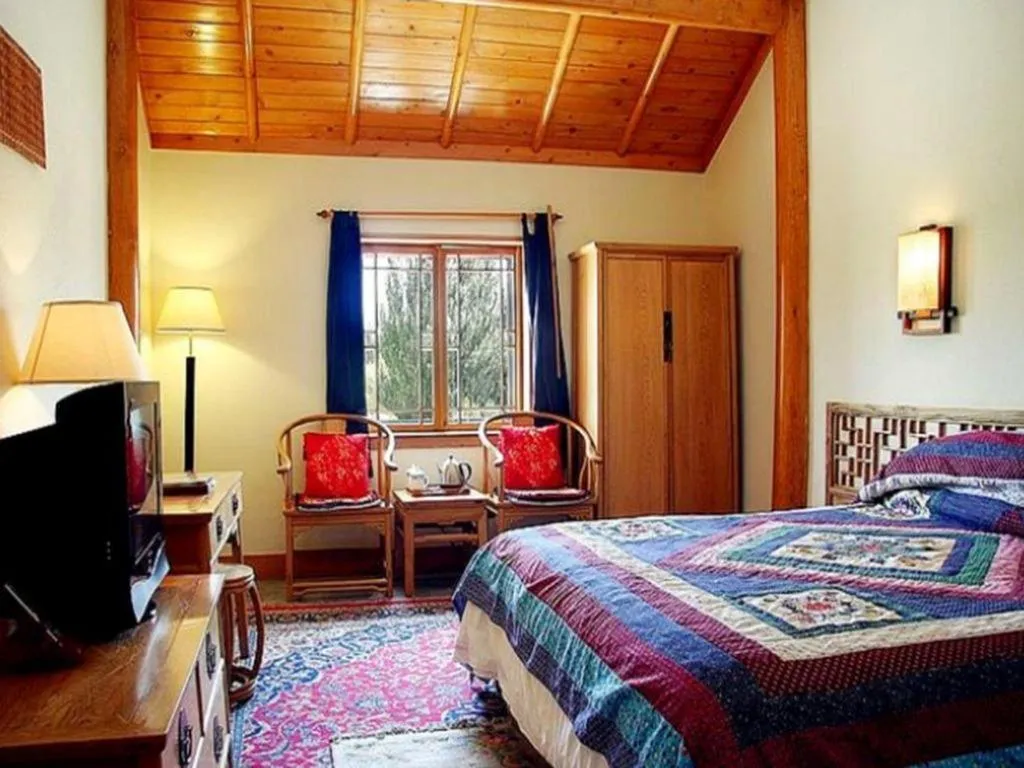 Bed in The Silk Road Dunhuang Hotel