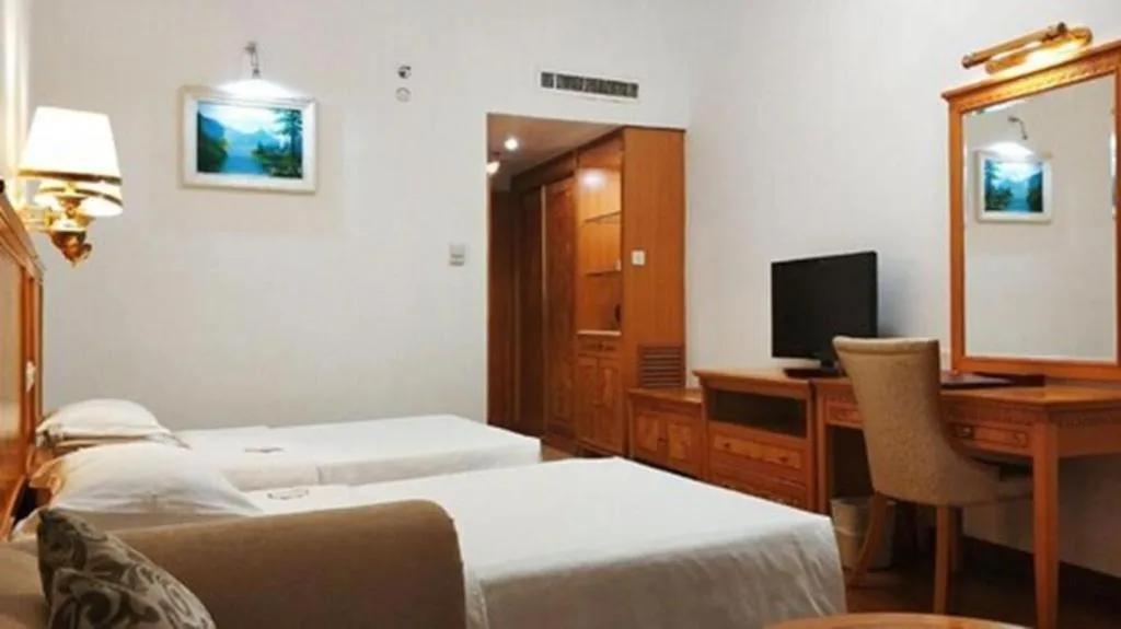 Bed in Zhuhai Dehan Hotel