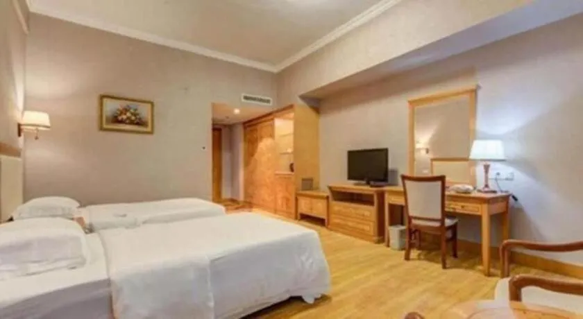 Bed in Zhuhai Dehan Hotel